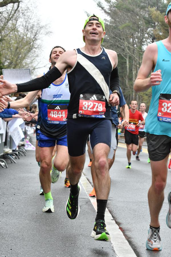 Chris high-fives spectators along the course