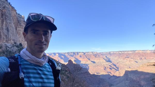 Chris smiles with the canyon in the background