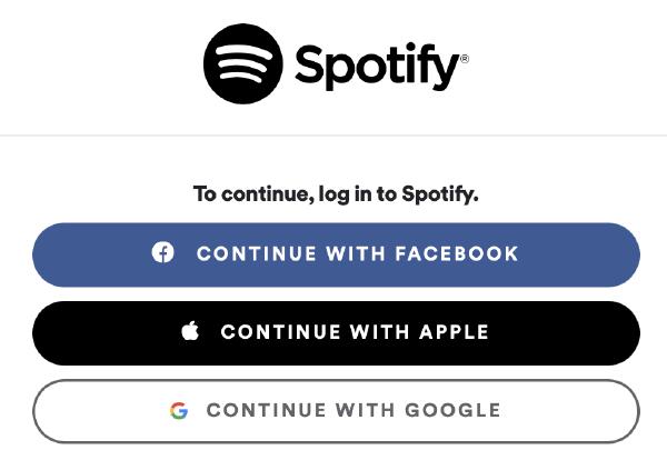 A screenshot of Spotify's login page showing Facebook, Apple, and Google options